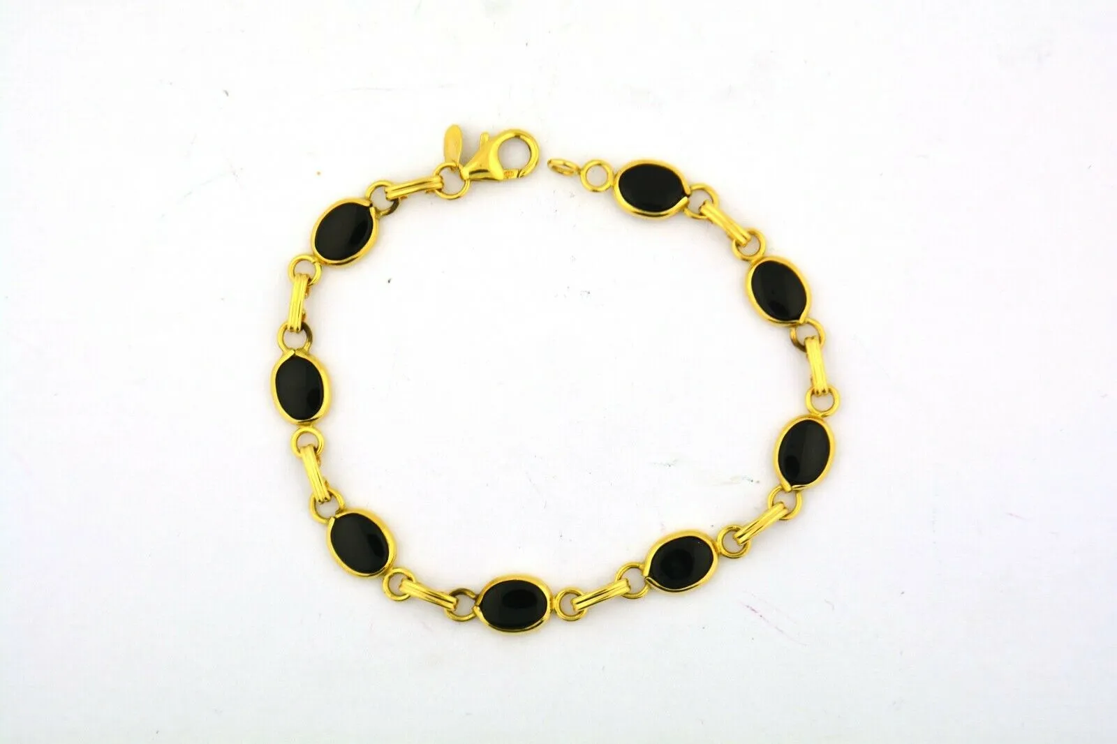 14KY Gold 7.25IN Oval Onyx Link Bracelet 6.6G (Eight 7x5MM Oval Onyx) Bezel Set