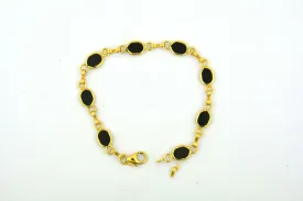 14KY Gold 7.25IN Oval Onyx Link Bracelet 6.6G (Eight 7x5MM Oval Onyx) Bezel Set