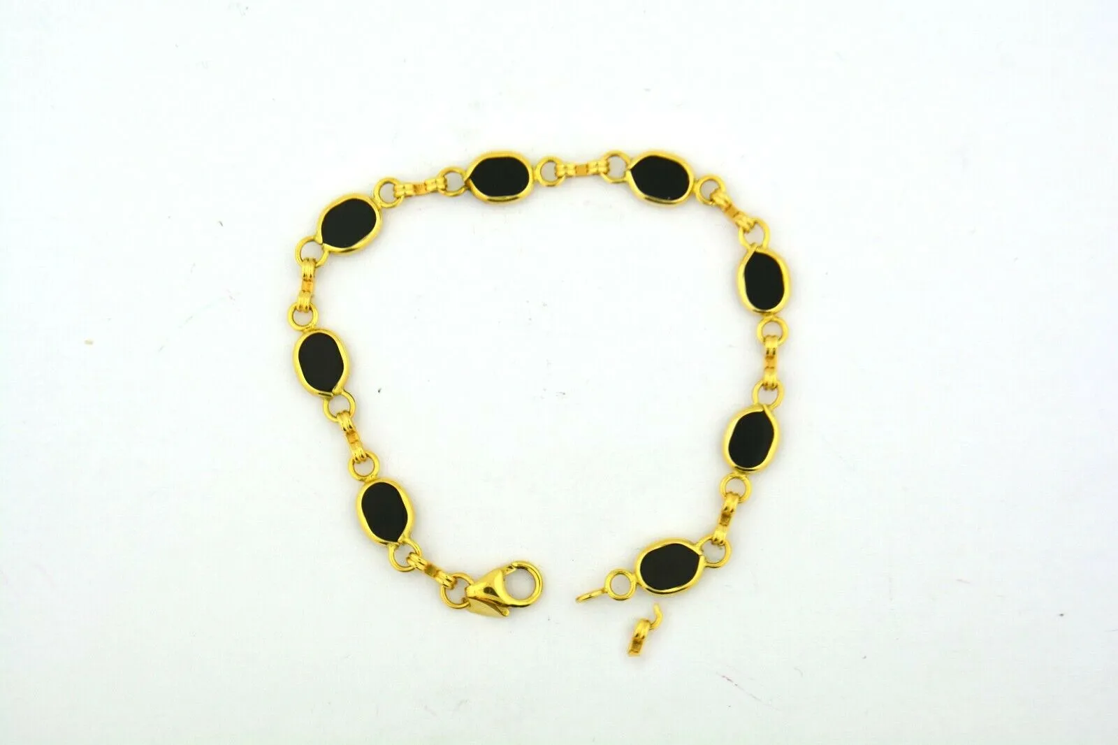 14KY Gold 7.25IN Oval Onyx Link Bracelet 6.6G (Eight 7x5MM Oval Onyx) Bezel Set